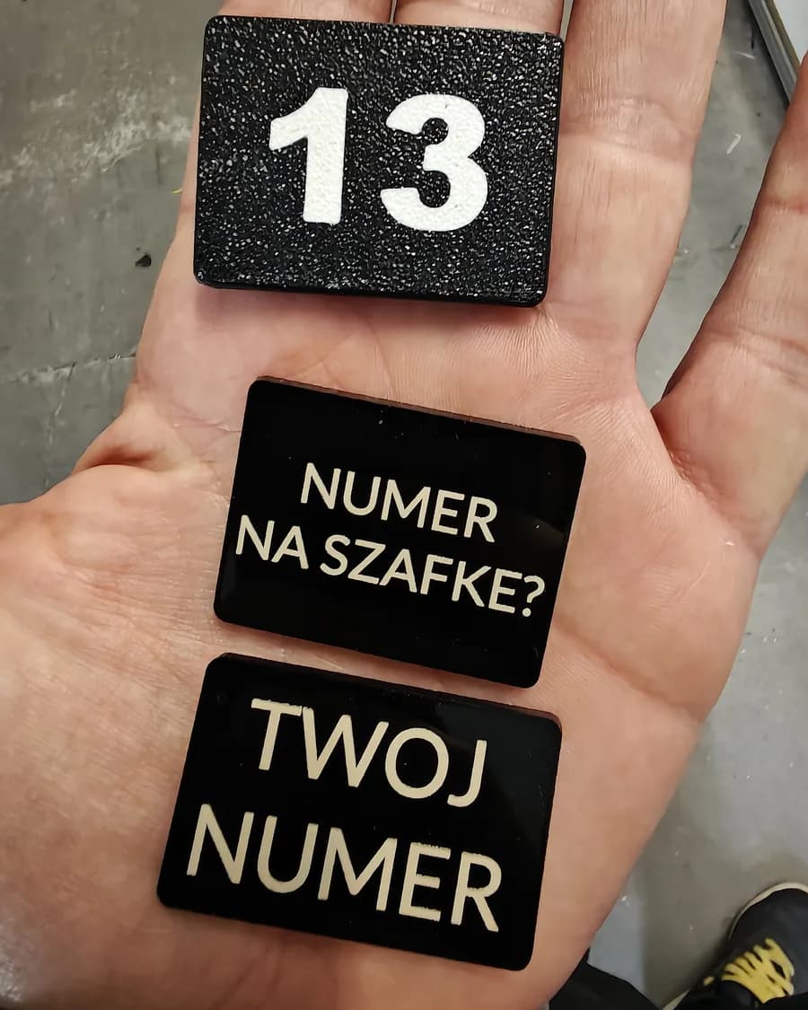 Engraved black acrylic signs - workshop photo