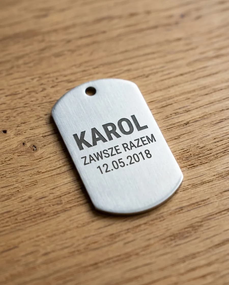 Engraved dog tag in hand