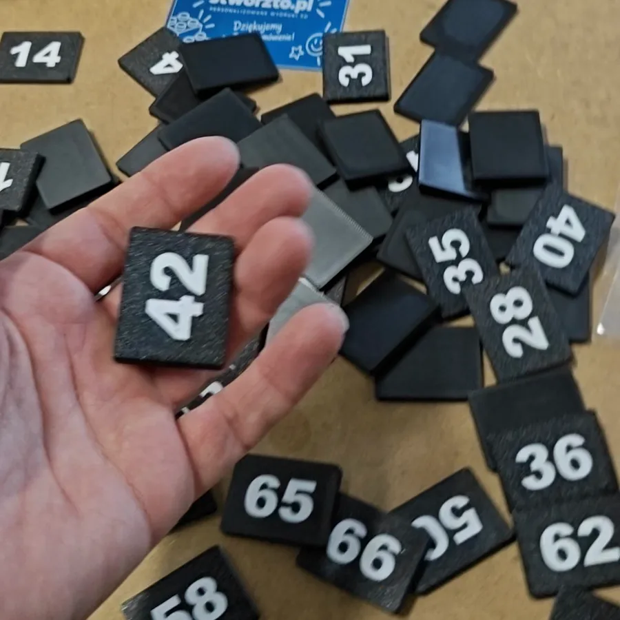 Number tags fresh from the printer - workshop photo